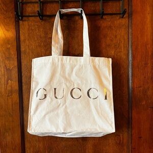 NWOT Gucci white cotton tote bag gussetted with silver front foil brand luxury